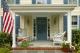 Porch With Wicker Chairs and Bench